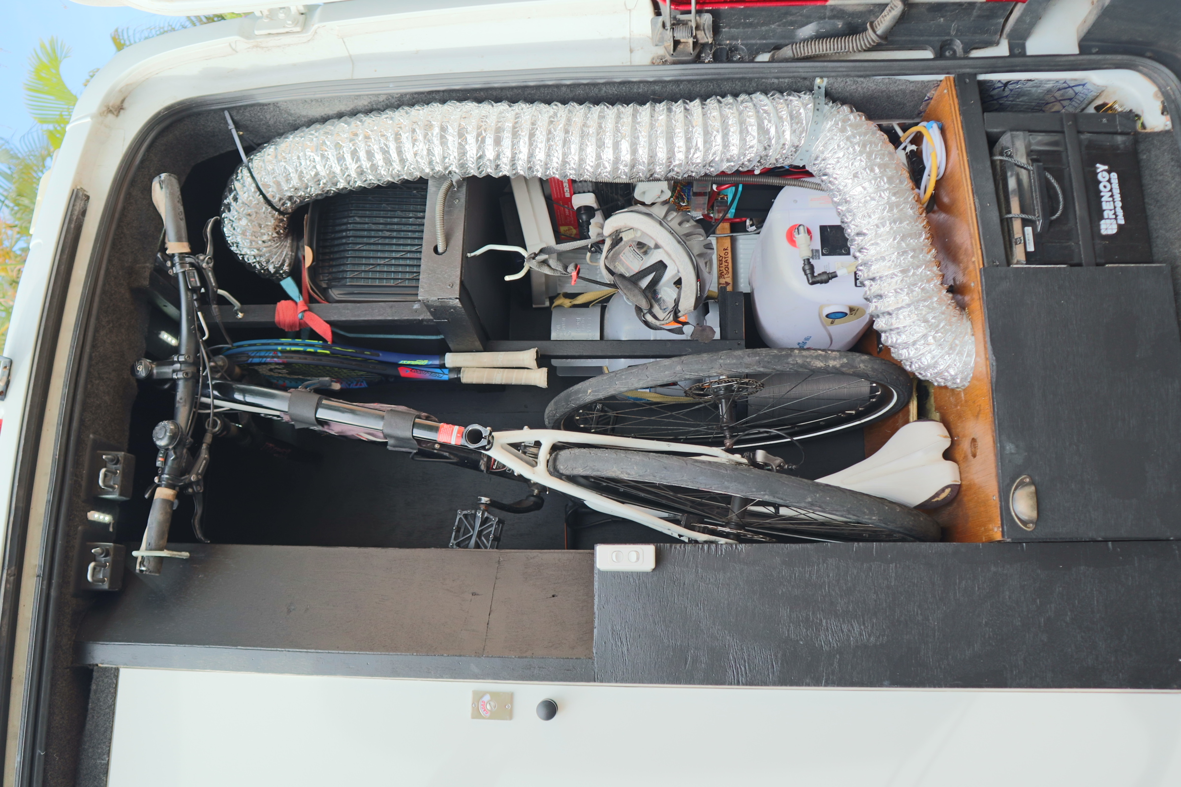 Garage area with spare gas bottle stored securely